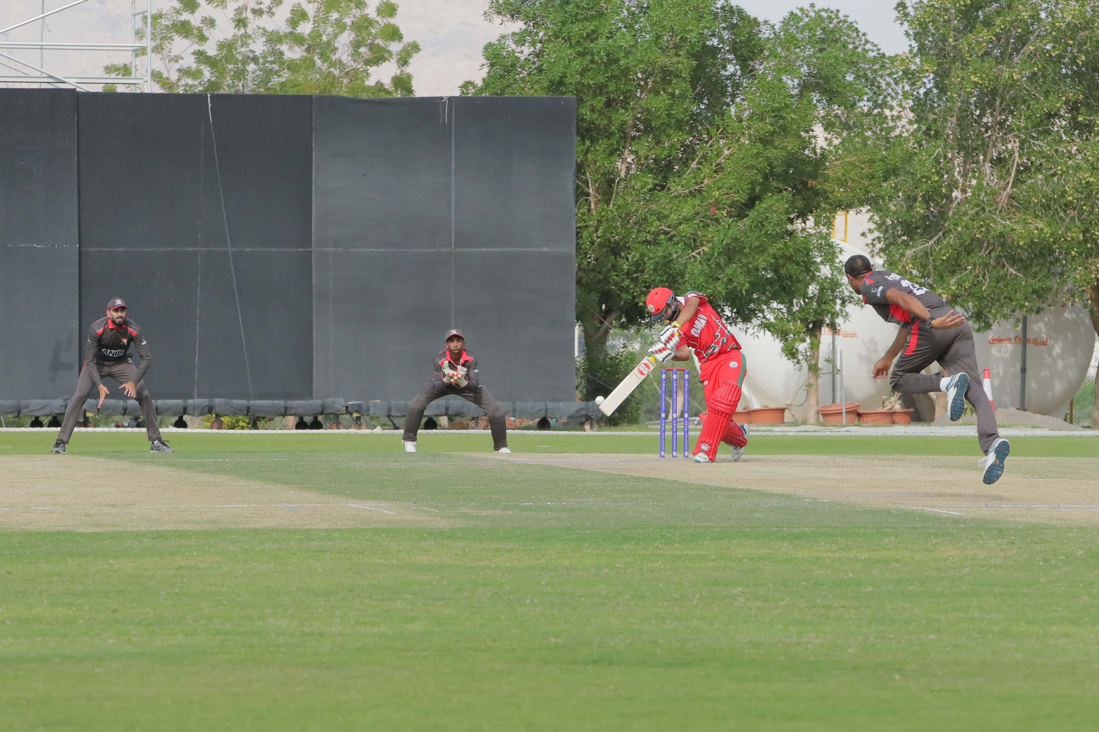 Oman opener Jatinder Singh hitting a four against UAE