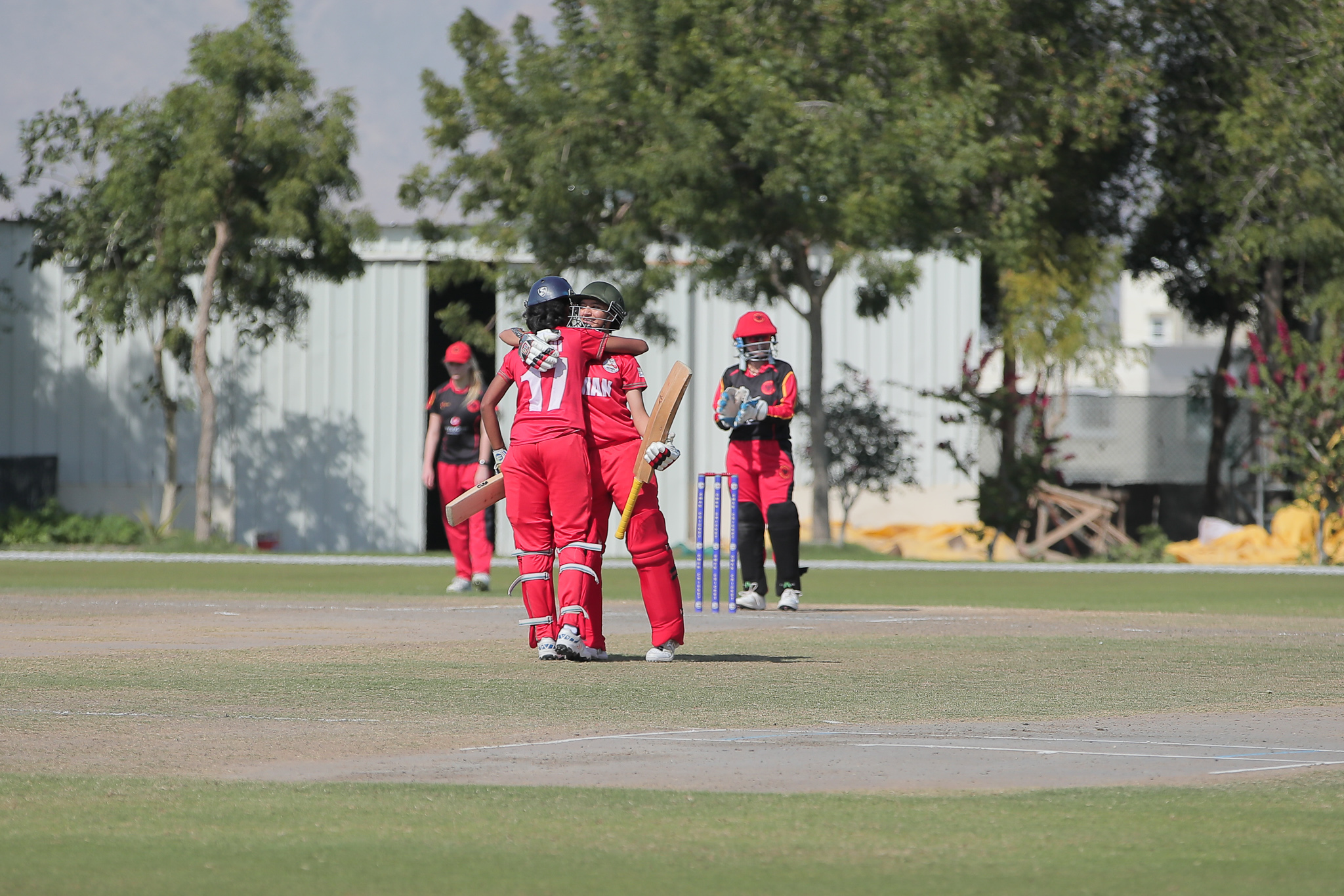 Oman openers Fiza Javed and Sakshi Shetty celebrate against Germany in Amerat