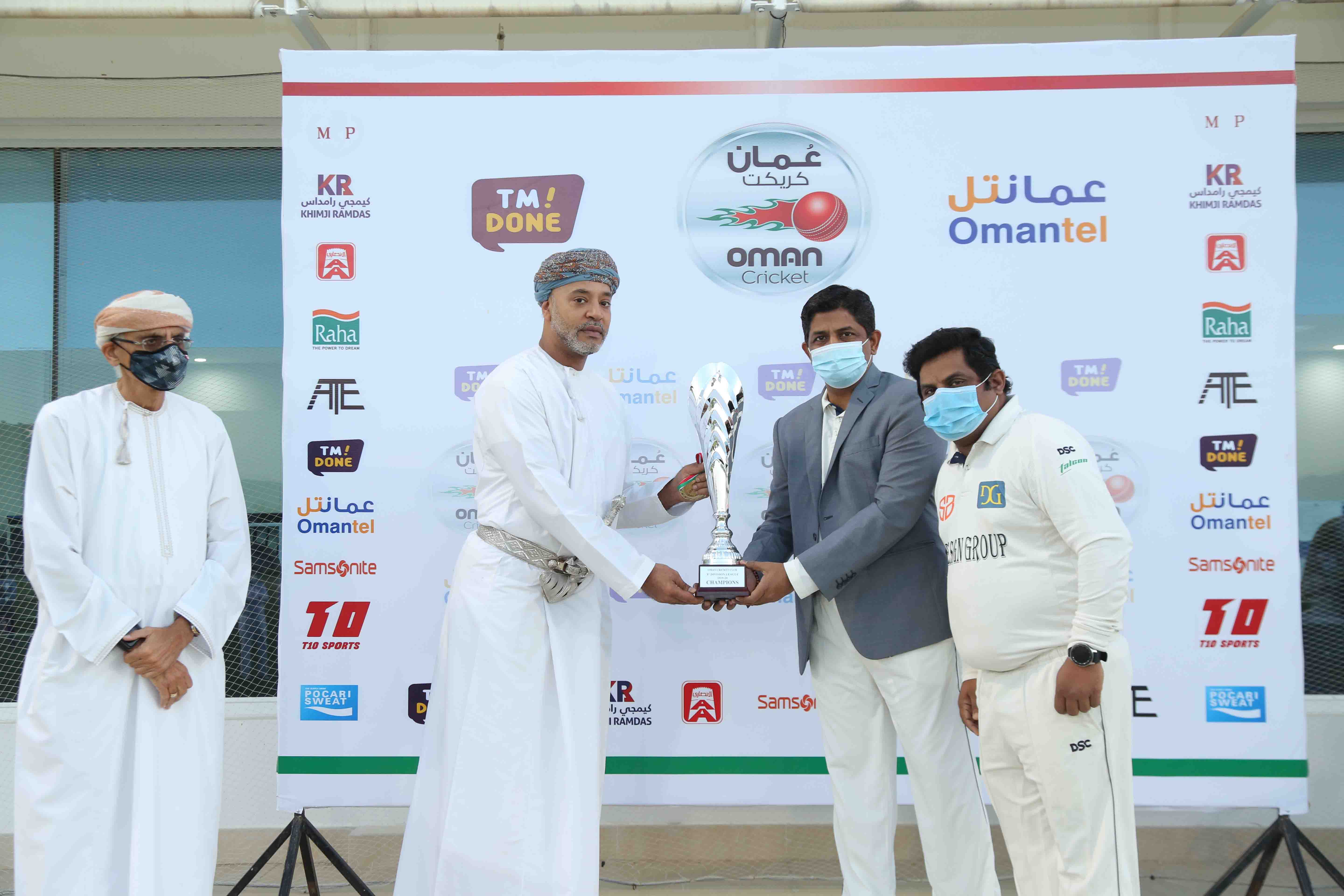 Design Group captain receiving E Division Winner's Trophy