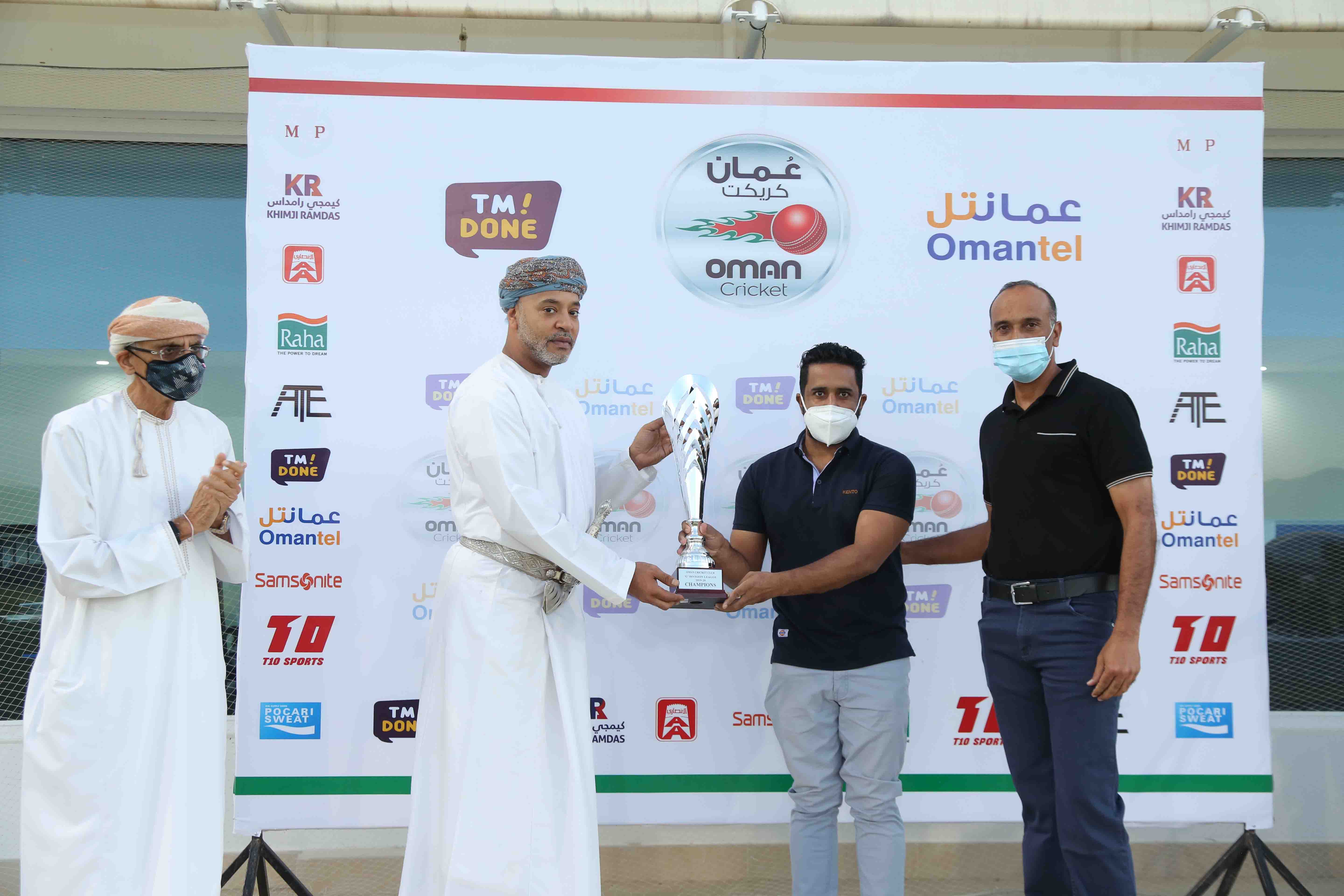 Gitacs captain receiving the G Division Winner's Trophy