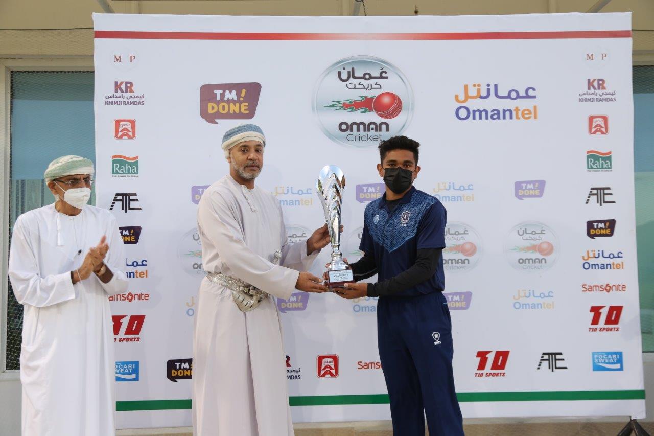 ISM Under-19 captain Azam Ali receiving the winner's trophy