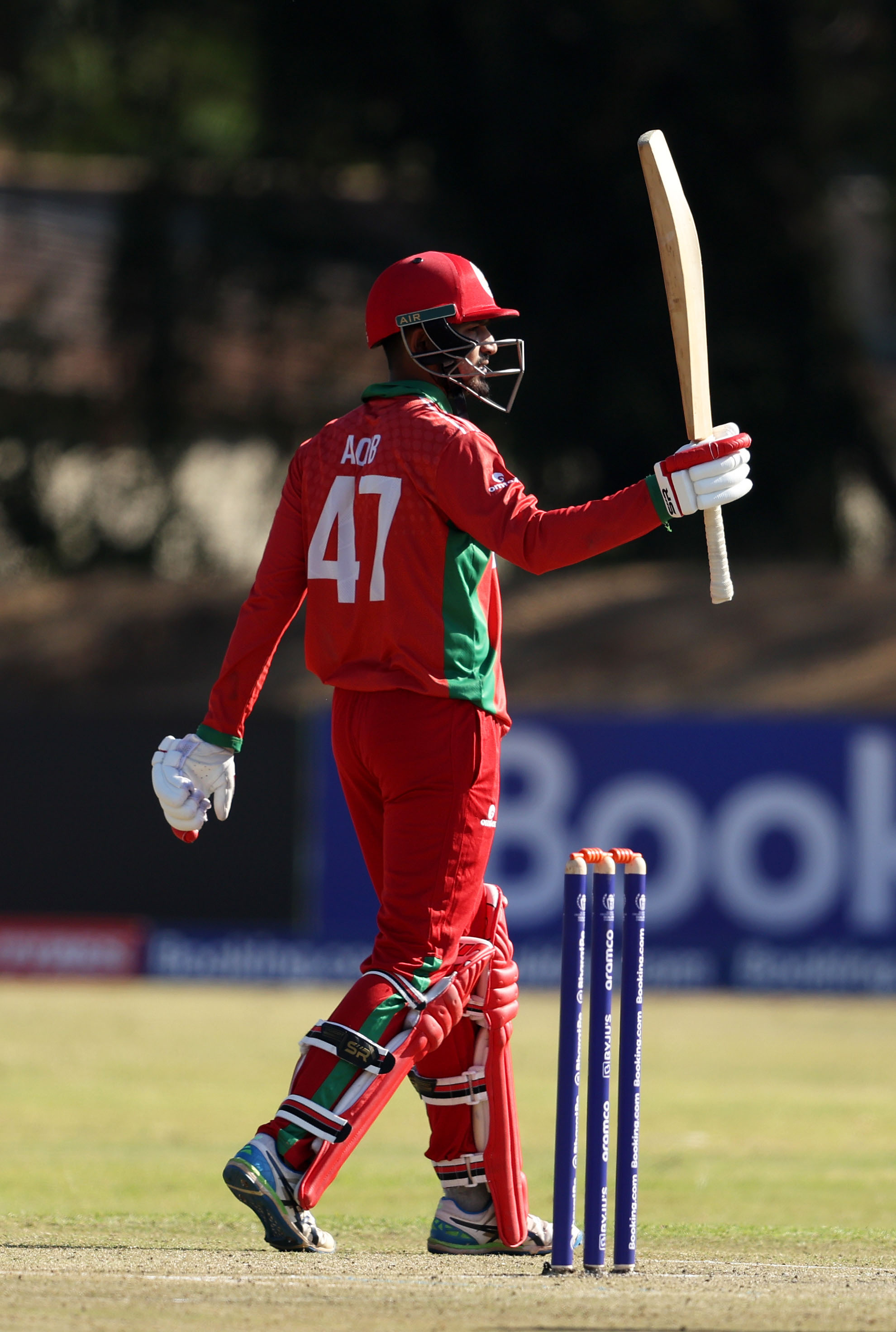 BULAWAYO, ZIMBABWE - JUNE 19: Aaqib IIyas of Oman celebrates their half century during the ICC Men's Cricket World Cup Qualifier Zimbabwe 2023 match between Ireland and Oman at Bulawayo Athletic Club on June 19, 2023 in Bulawayo, Zimbabwe. (Photo by Matthew Lewis-ICC/ICC via Getty Images)