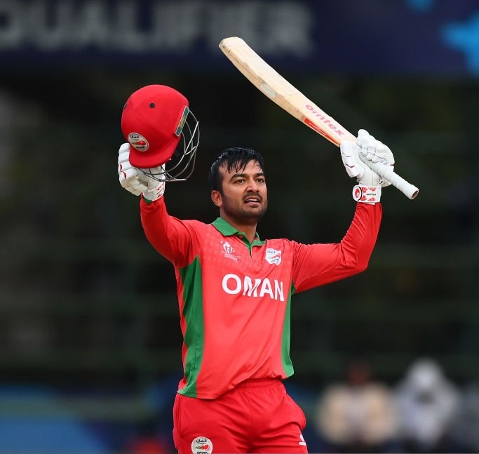 HARARE, ZIMBABWE - JULY 03: Ayaan Khan of Oman celebrates their century during the ICC Men's Cricket World Cup Qualifier Zimbabwe 2023 Super 6 match between Netherlands and Oman at Harare Sports Club on July 03, 2023 in Harare, Zimbabwe. (Photo by Alex Davidson-ICC/ICC via Getty Images)
