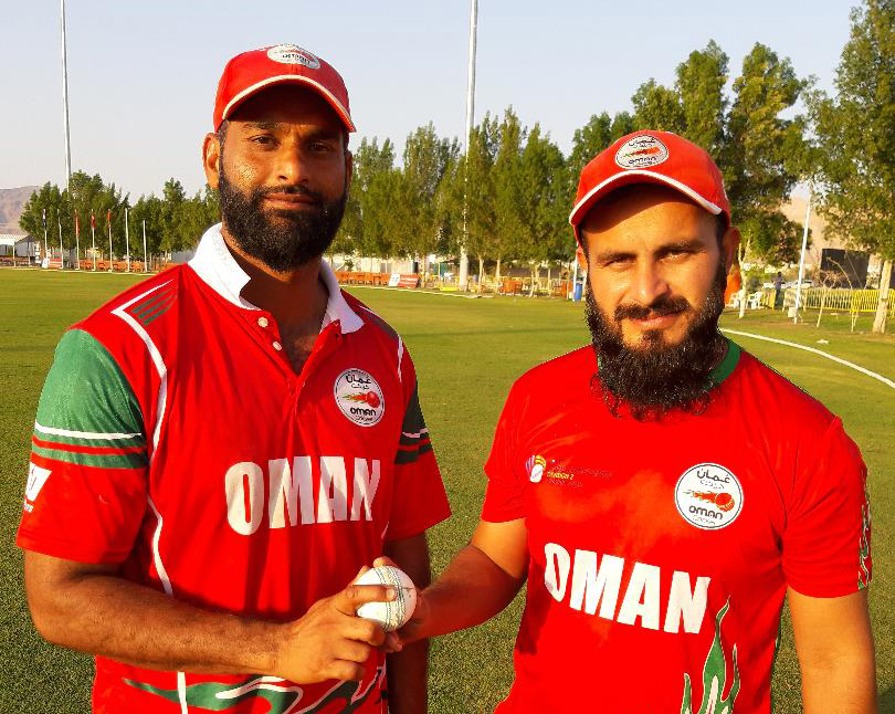 Hat-trick hero Khawar Ali with his captain Zeeshan Maqsood after Oman's win over Netherlands